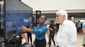 student presenting a poster